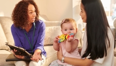 Parent and child talking to provider