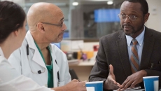 Doctors meeting with executive