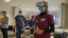 A clinician wearing a VR headset