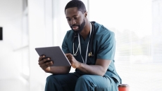 Doctor looking at tablet