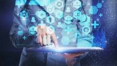 Medical worker pressing tablet with overlay of digital icons