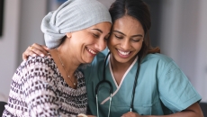 A doctor and a cancer patient next to each other
