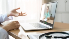 Person talking to doctor on laptop