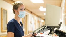 medical professional looking at screen