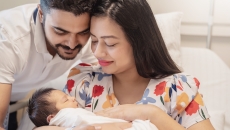 Parents holding a baby