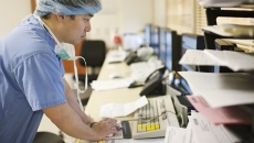 A doctor using a desktop computer