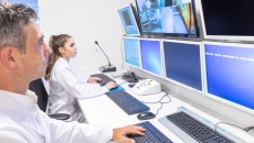 Doctors looking at medical images on a monitor