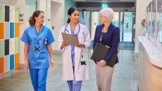 Healthcare workers talking in hallway