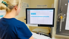 A nurse using Modeus' HS8 electronic medication register