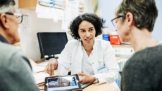Doctor showing patients medical images on a tablet