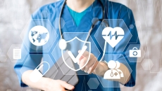 Healthcare worker pointing to medical icons
