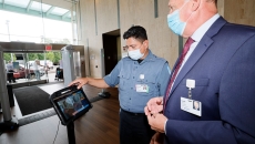 People look at a security screen