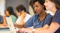 Medical students studying at a computer