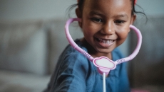 Child with toy stethoscope
