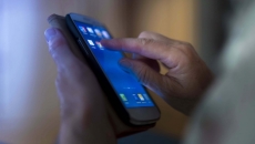 Hands on a smartphone