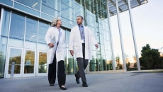 Doctors walking outside of a hospital