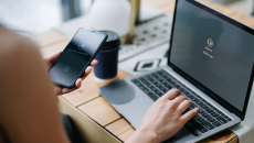 A patient uses a mobile phone to verify identity, which supports data privacy across industries, including telehealth.