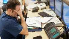 Stressed healthcare worker at a desk