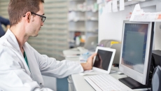 Researcher with real-world data in lab