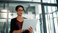 Worker in office using tablet