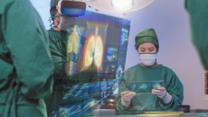 Surgeons looking at digital imgaining display