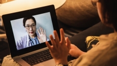 A telehealth consultation via laptop pc