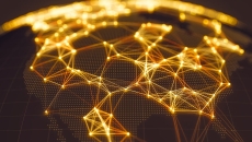 Black map of U.S. lit up with data connectivity in bands of gold light