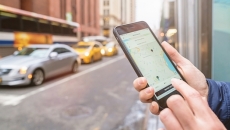 Person using rideshare app on smartphone