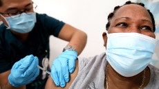 Personreceives COVID-19 vaccine
