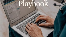 Healthcare worker using a laptop