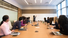 People gathered at a board meeting
