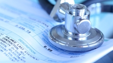 Cancer care bill and stethoscope