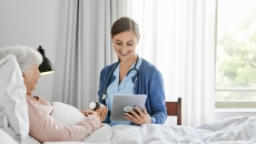 Nurse reviews discharge instructions with patient