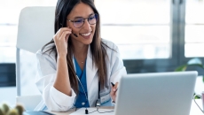 A clinician on a video call with a patient