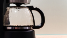 A coffee pot in a machine