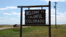 A sign reading "Welcome to Colorful Colorado"