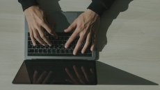 Hands at a keyboard
