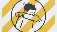 Cough or sneeze into your elbow Covid-19 poster by the NZ government.