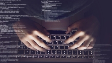 Hands with text scrolling in front