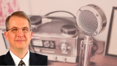 Dan Golder's headshot on a picture of a mic