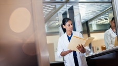 Doctor looking at a folder