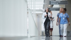 Healthcare workers walking in hallway