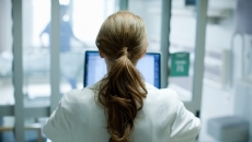 Healthcare worker looking at screen