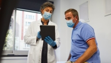 doctor consults with patient