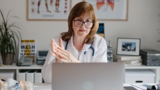 A doctor on a laptop