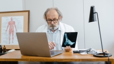 A medical professional on the computer