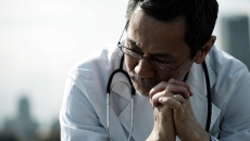 A doctor looking worried