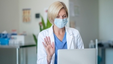 A doctor in front of a computer