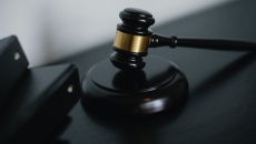A gavel next to binders