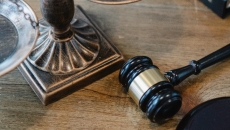 A gavel sitting on a desk